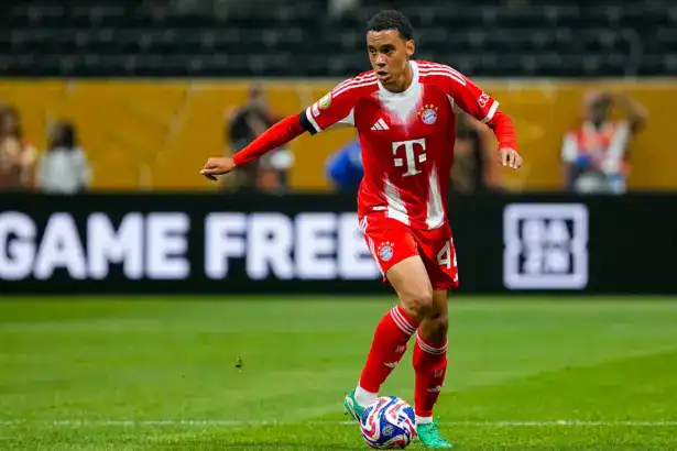 Serge Gnabry in a white FC Bayern Munich kit during a match