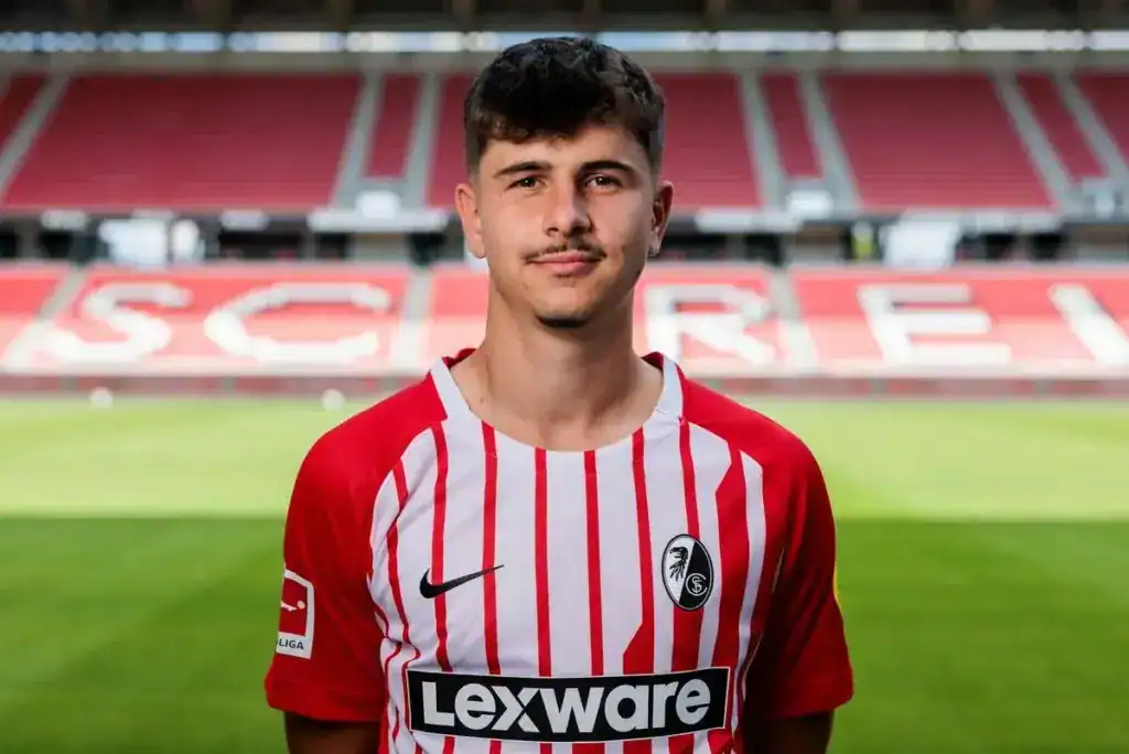 Portrait of Karl Steinmann wearing the red and white striped SC Freiburg home jersey in a stadium