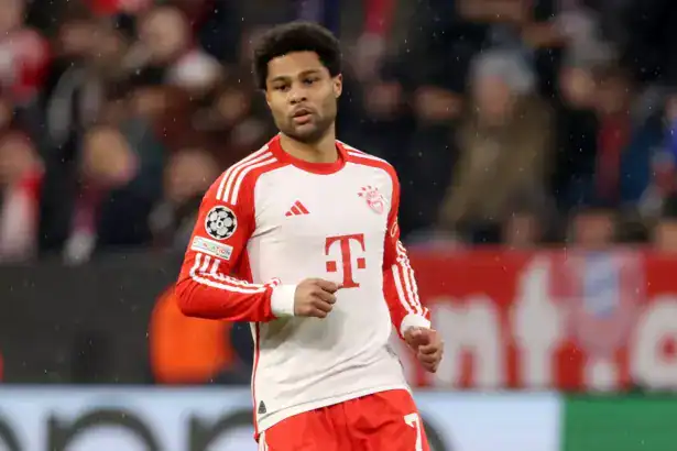 Serge Gnabry in a white FC Bayern Munich kit during a match